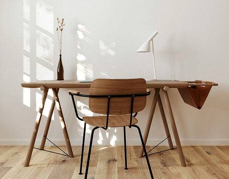 Simple table with chair, lamp, and vase.