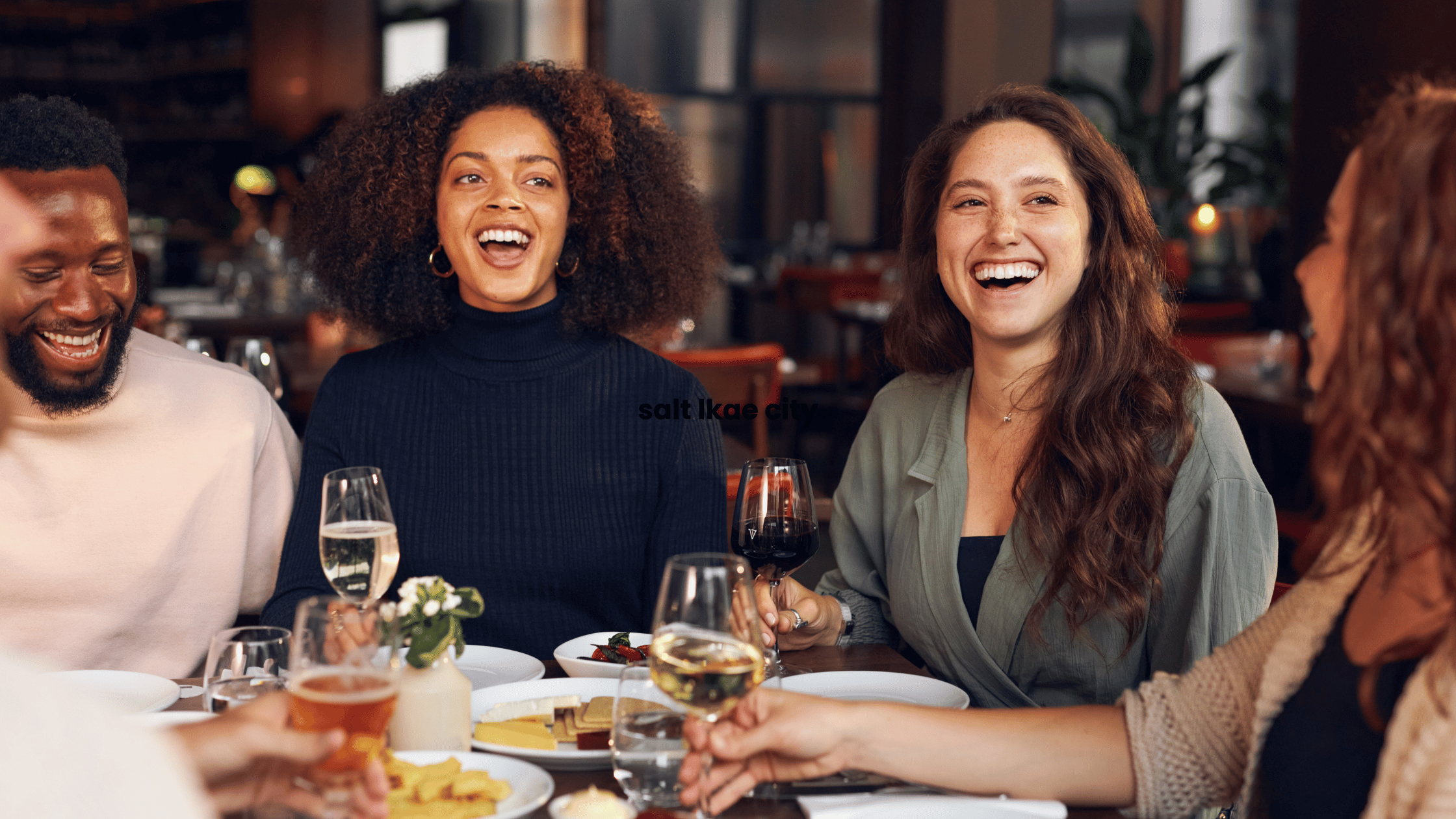 Group of friends sharing a meal and laughing