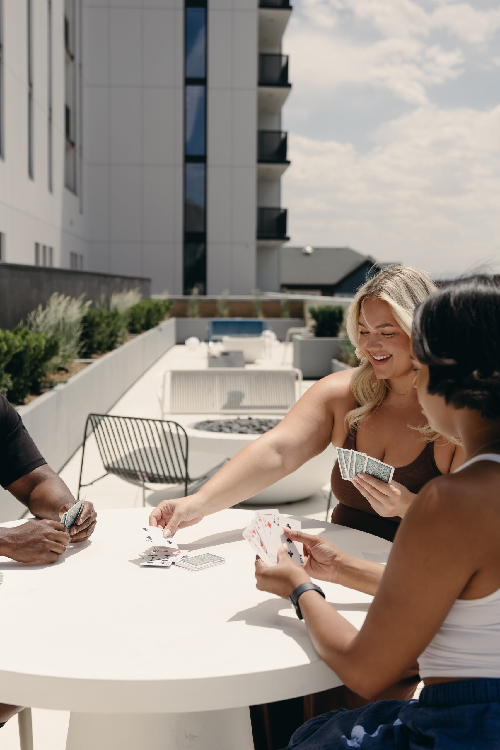 Friends enjoying the third-floor terrace at Brix Residences in Salt Lake City.