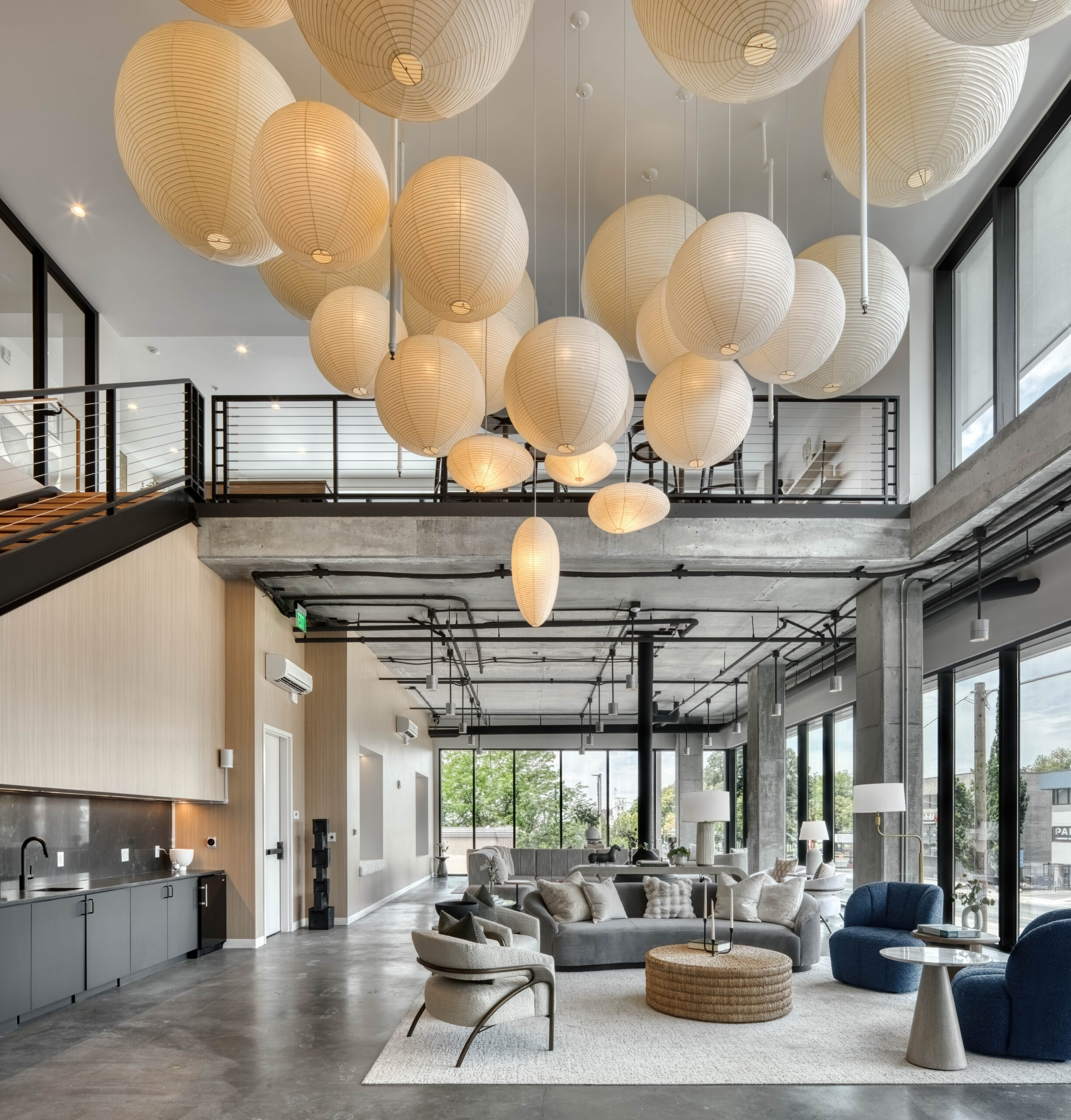 apartment common space with seating and circular lights overhead