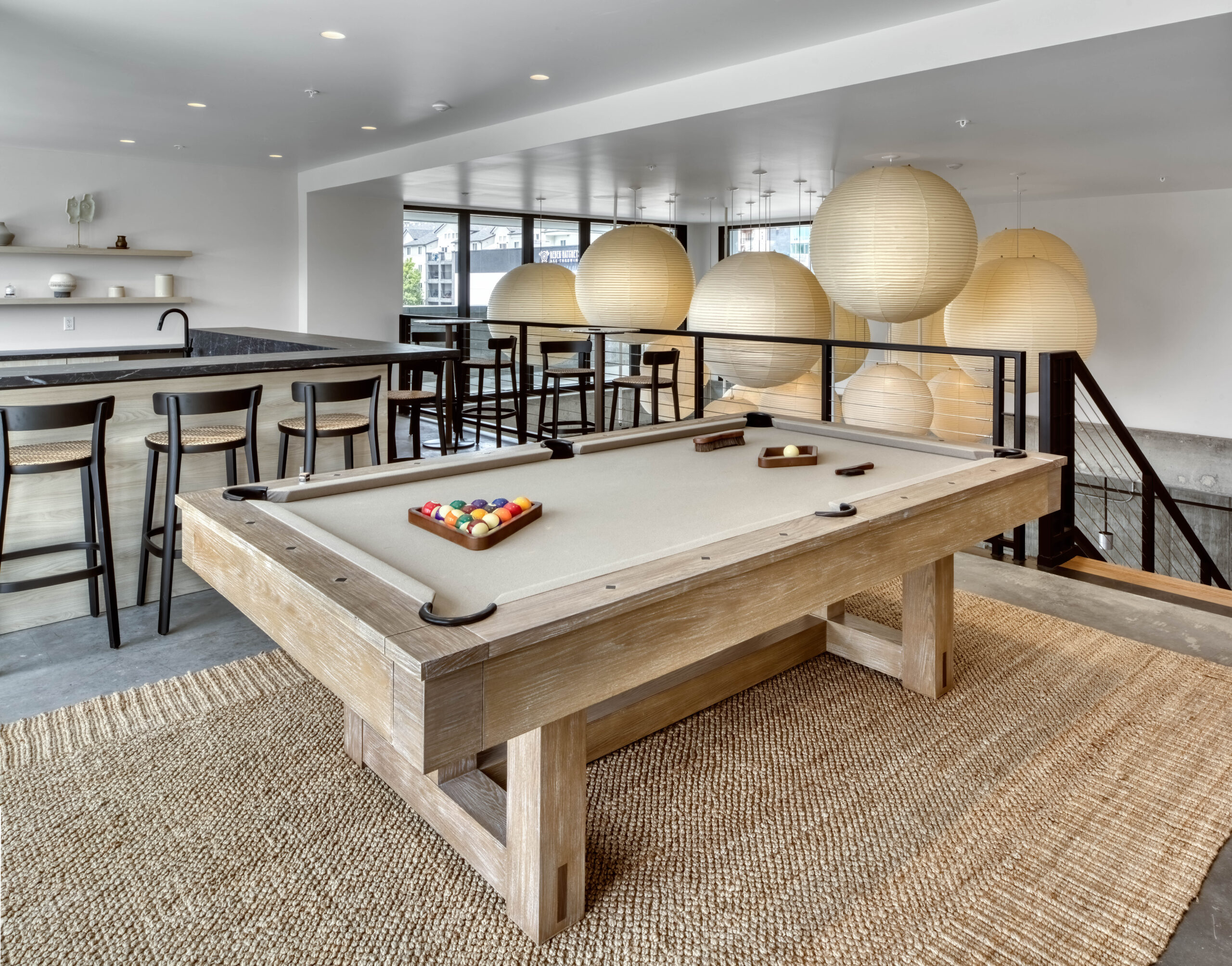 Pool table and high top bar space behind