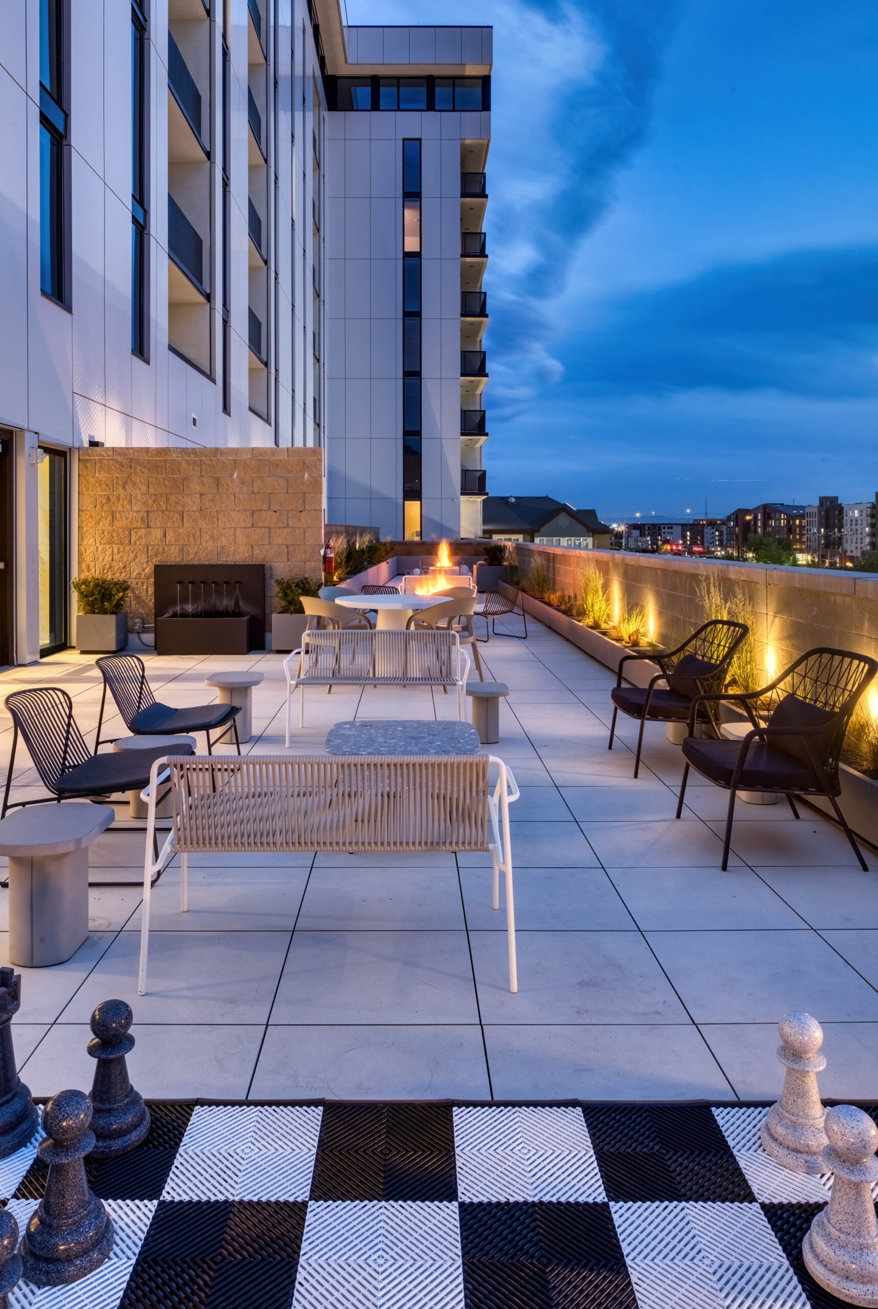 apartment patio space with lights and seating areas