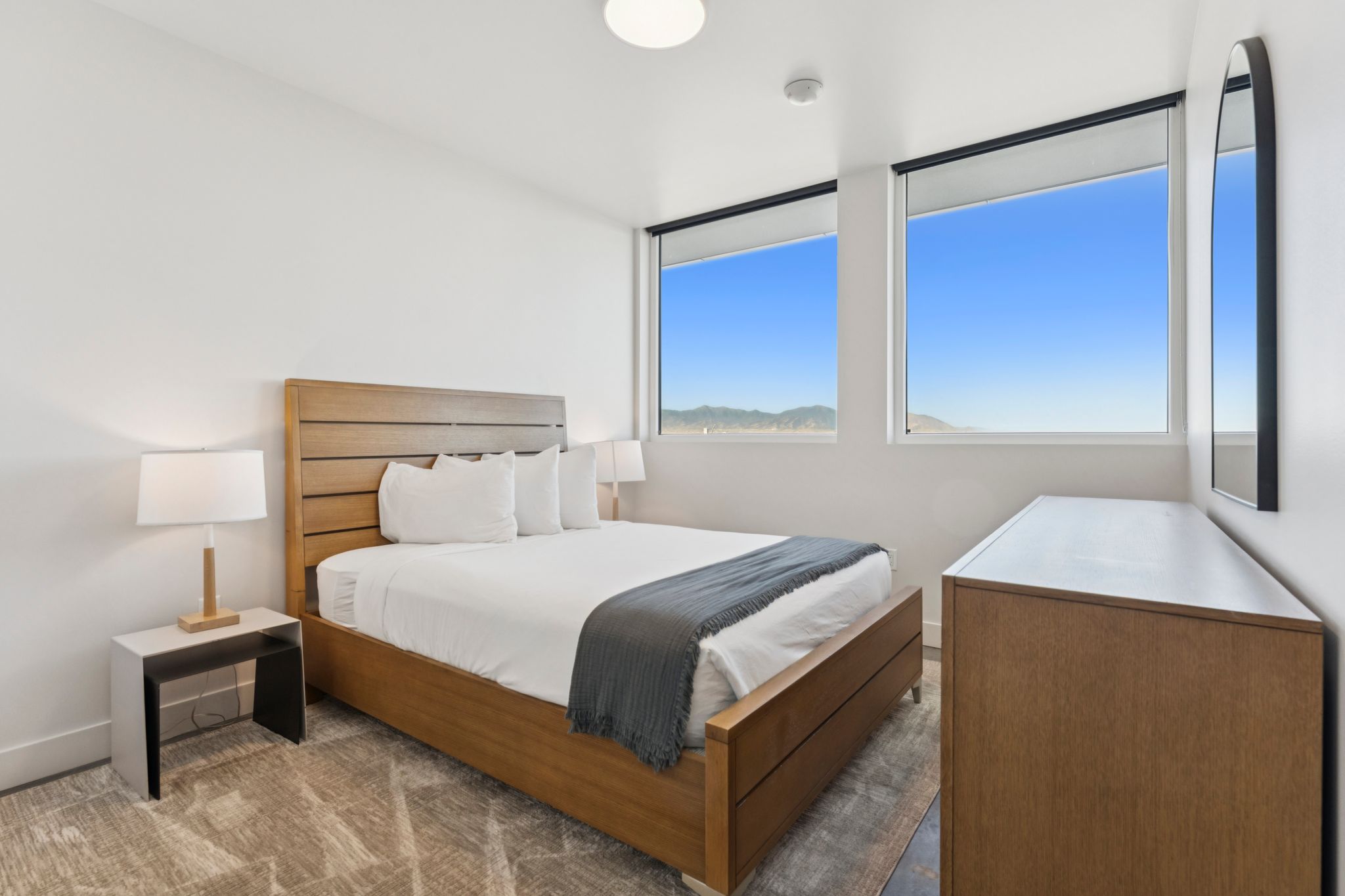 Bedroom with large windows in downtown SLC apartment