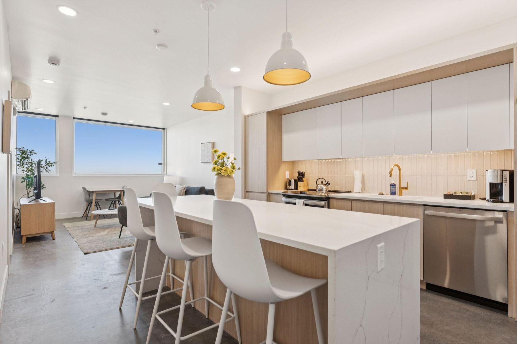 Modern kitchen with island in SLC apartment