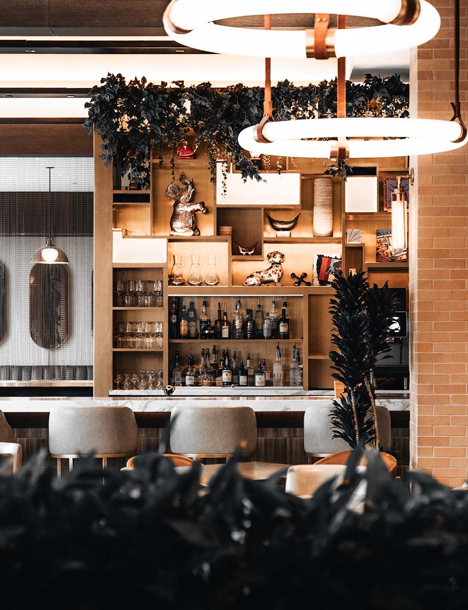 Coworking cafe at Edison House with bar top seating and elegant decor.